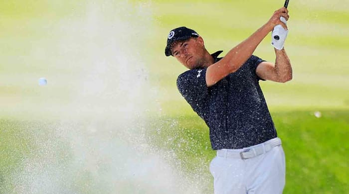 Jordan Spieth plays a shot from a bunker during the 2024 Players Championship at TPC Sawgrass in Ponte Vedra Beach, Fla.